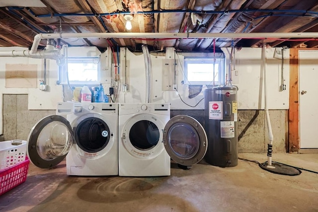 laundry room featuring washer and dryer, laundry area, water heater, and a wealth of natural light