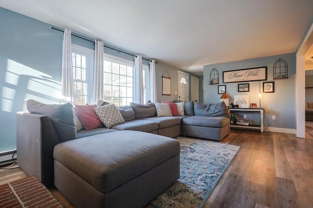 living room with baseboards and wood finished floors