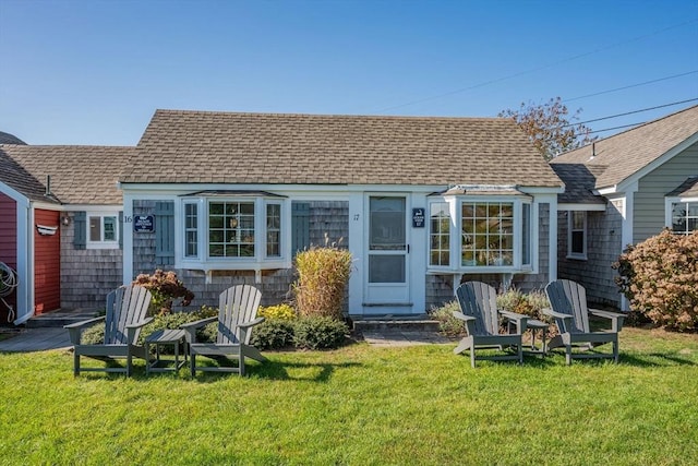 135 S Shore Dr Unit 17, Yarmouth, MA 02664 - rear view of property featuring a shingled roof and a yard