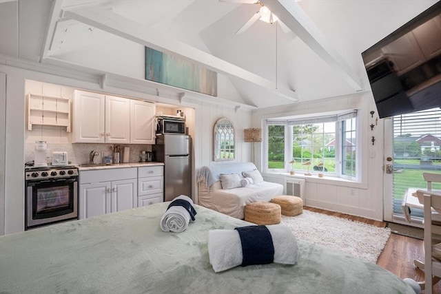 135 S Shore Dr Unit 17, Yarmouth, MA 02664 - bedroom with freestanding refrigerator, a sink, access to outside, wood finished floors, and ceiling fan