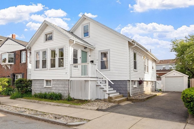 33 Alden Ave, Revere, MA 02151 - view of front of house featuring an outbuilding, driveway, and a garage