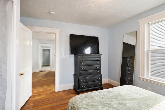 33 Alden Ave, Revere, MA 02151 - bedroom featuring wood finished floors, multiple windows, and baseboards