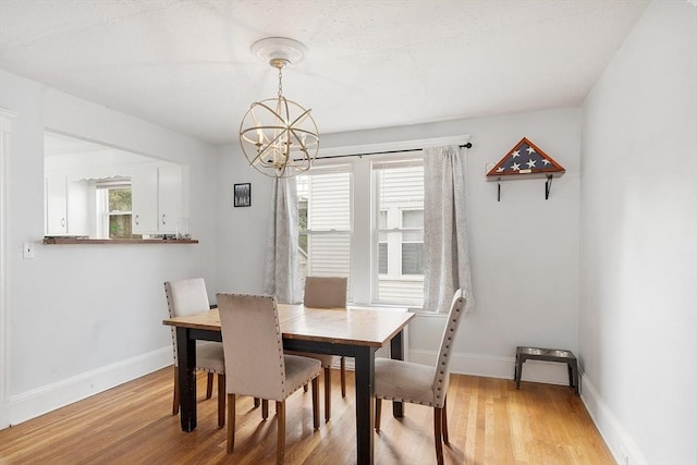 33 Alden Ave, Revere, MA 02151 - dining area with a chandelier, healthy amount of natural light, wood finished floors, and baseboards