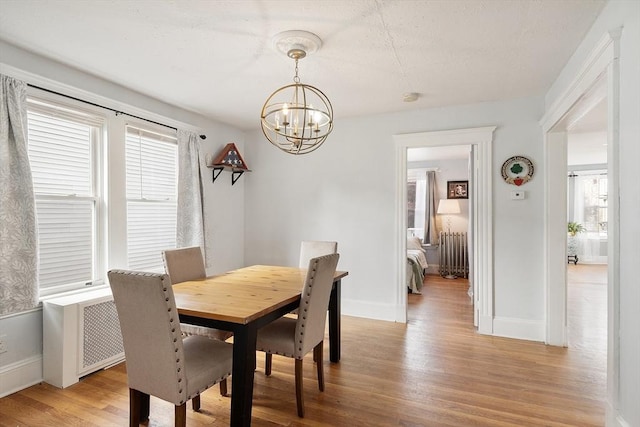 33 Alden Ave, Revere, MA 02151 - dining room with a chandelier, light wood-style floors, plenty of natural light, and baseboards