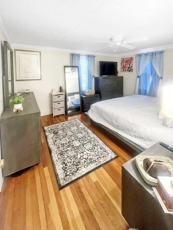 16 Samoset Rd, Yarmouth, MA 02664 - bedroom featuring a ceiling fan, crown molding, and wood finished floors