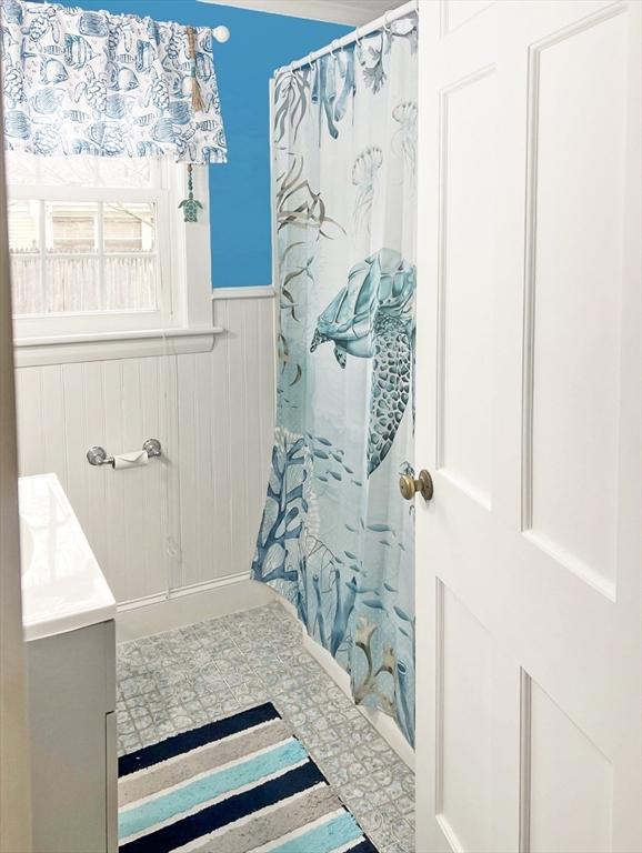 16 Samoset Rd, Yarmouth, MA 02664 - full bath featuring a wainscoted wall, vanity, and a shower with curtain
