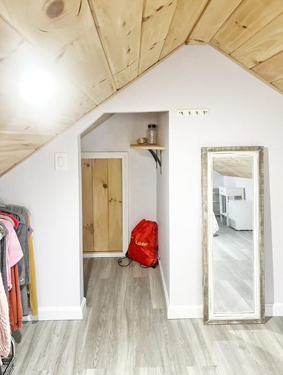 16 Samoset Rd, Yarmouth, MA 02664 - additional living space featuring light wood-style floors, baseboards, and lofted ceiling