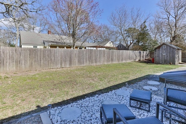 16 Samoset Rd, Yarmouth, MA 02664 - view of yard featuring a patio area, a fenced backyard, an outbuilding, and a storage unit
