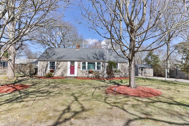 16 Samoset Rd, Yarmouth, MA 02664 - view of front of property with a front lawn, an outdoor structure, and a chimney