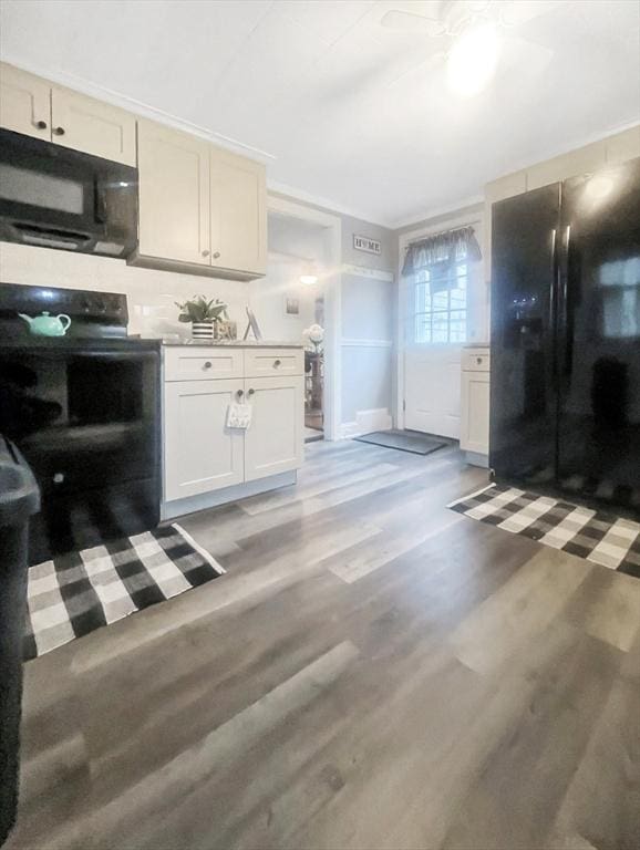 16 Samoset Rd, Yarmouth, MA 02664 - kitchen featuring light wood-style floors, light countertops, black appliances, and ceiling fan