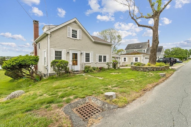 650 Pearse Rd, Swansea, MA 02777 - traditional home featuring a chimney and a front yard