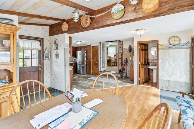 650 Pearse Rd, Swansea, MA 02777 - dining space featuring light wood-style flooring, wallpapered walls, plenty of natural light, and wooden ceiling with exposed beams