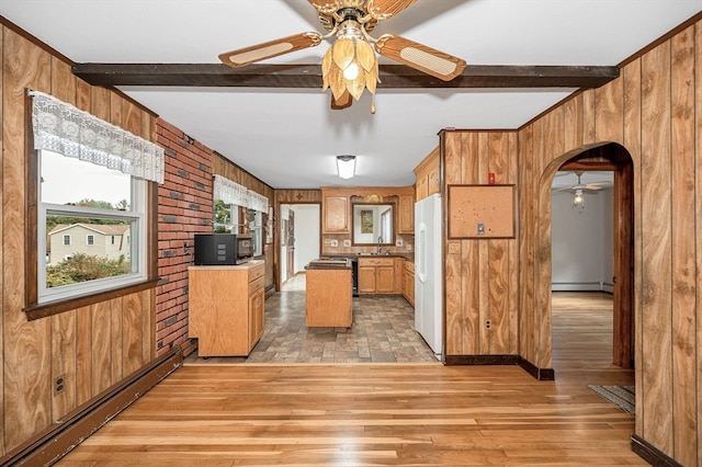 kitchen with a baseboard radiator, light hardwood / wood-style flooring, wood walls, beamed ceiling, and white refrigerator with ice dispenser