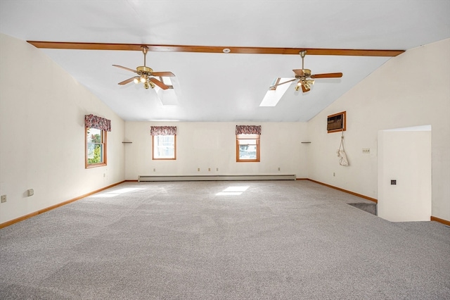 spare room featuring a baseboard radiator, a skylight, carpet flooring, and ceiling fan