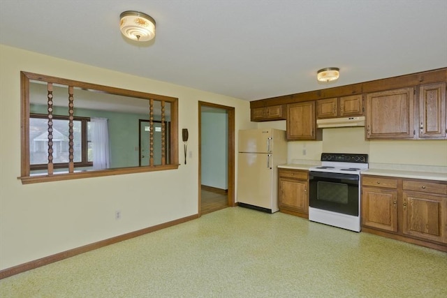51 Hardy St, Springfield, MA 01129 - kitchen with range with electric cooktop, freestanding refrigerator, under cabinet range hood, and brown cabinetry