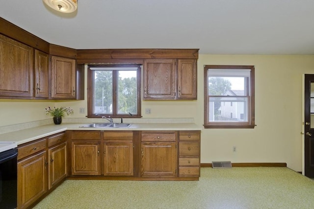 51 Hardy St, Springfield, MA 01129 - kitchen with a sink, brown cabinets, and light countertops