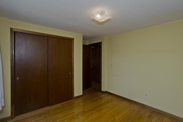 51 Hardy St, Springfield, MA 01129 - unfurnished bedroom featuring light wood-type flooring, a closet, and baseboards
