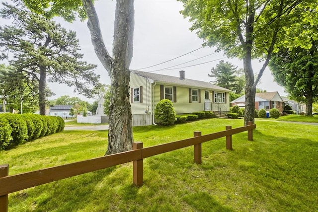 51 Hardy St, Springfield, MA 01129 - view of front of house featuring a front lawn and a chimney