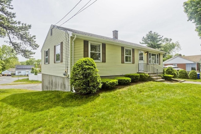 51 Hardy St, Springfield, MA 01129 - view of front of property featuring a chimney and a front lawn