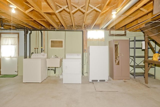 51 Hardy St, Springfield, MA 01129 - basement with washer and dryer, freestanding refrigerator, and a sink