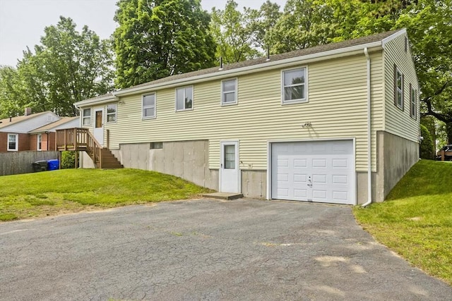 51 Hardy St, Springfield, MA 01129 - view of front facade featuring an attached garage, a front yard, driveway, and stairs