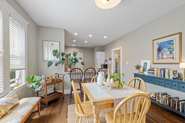dining area featuring wood finished floors and recessed lighting