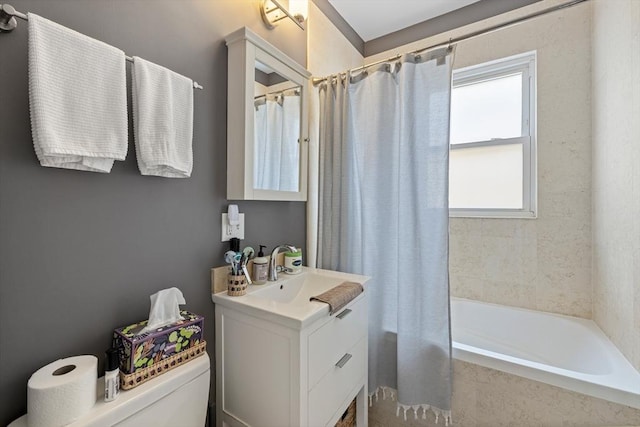 full bath with toilet, vanity, and shower / bath combo with shower curtain
