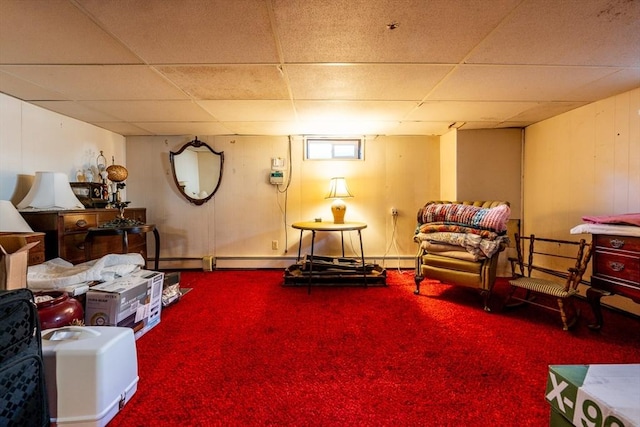 sitting room with carpet floors, a paneled ceiling, and baseboard heating