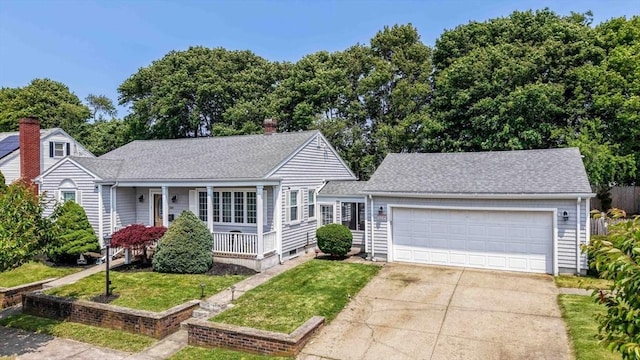 108 Nautilus St, New Bedford, MA 02744 - view of front of property featuring a porch, concrete driveway, an attached garage, a front lawn, and roof with shingles