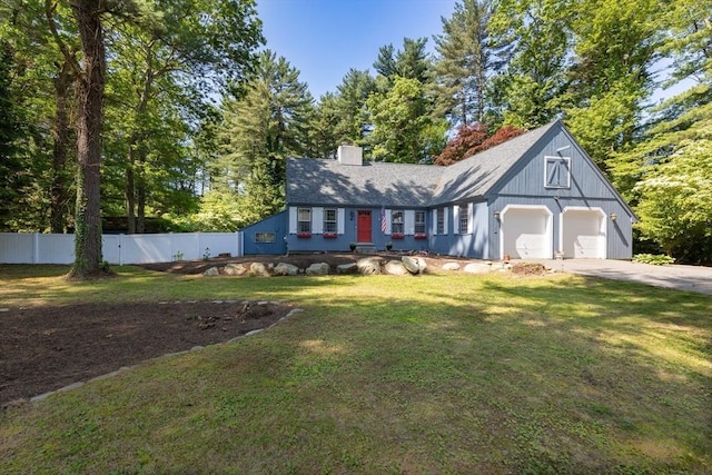 16 Summer St, Easton, MA 02356 - view of front facade with a garage, concrete driveway, and a chimney