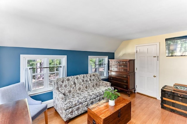 16 Summer St, Easton, MA 02356 - living area with lofted ceiling, light wood-type flooring, and baseboard heating
