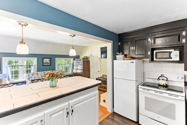 16 Summer St, Easton, MA 02356 - kitchen featuring white appliances, tile countertops, dark wood-style floors, pendant lighting, and dark cabinets