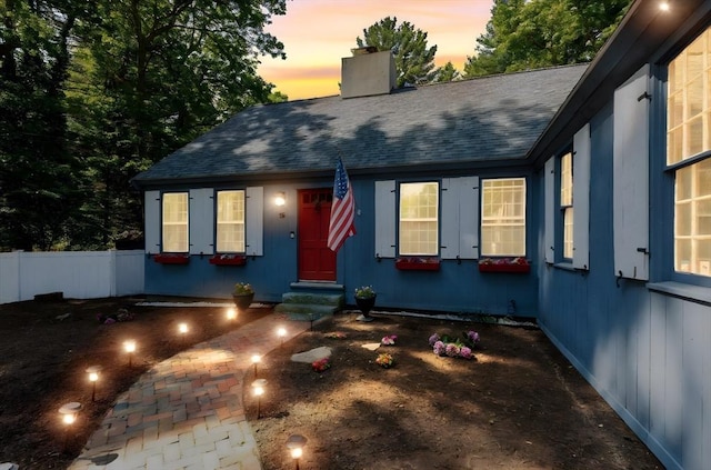 16 Summer St, Easton, MA 02356 - view of front facade featuring entry steps, a chimney, and a shingled roof