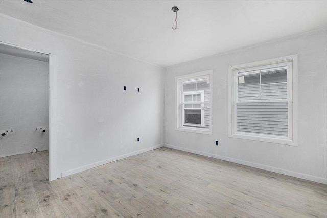 unfurnished room with light hardwood / wood-style flooring