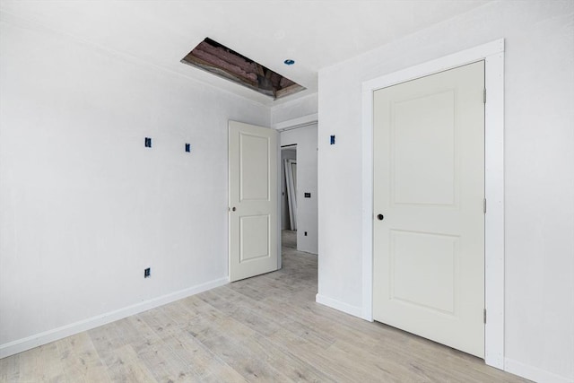 interior space with light hardwood / wood-style floors and a closet