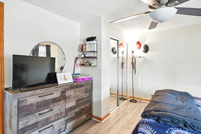 47 N Summer St, Holyoke, MA 01040 - bedroom with wood finished floors, baseboards, a textured ceiling, and a ceiling fan