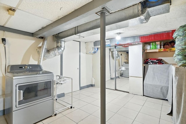 47 N Summer St, Holyoke, MA 01040 - finished below grade area featuring washer / dryer and tile patterned flooring