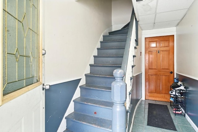 47 N Summer St, Holyoke, MA 01040 - staircase featuring a paneled ceiling and tile patterned floors
