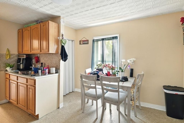 47 N Summer St, Holyoke, MA 01040 - dining area with an ornate ceiling, light colored carpet, and baseboards