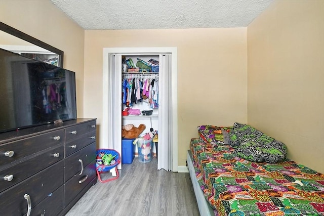 47 N Summer St, Holyoke, MA 01040 - bedroom featuring wood finished floors and a textured ceiling