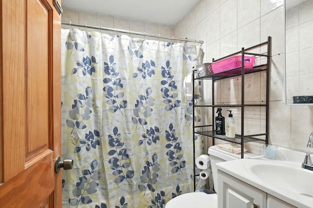 47 N Summer St, Holyoke, MA 01040 - full bathroom featuring tile walls, vanity, toilet, and a shower with shower curtain