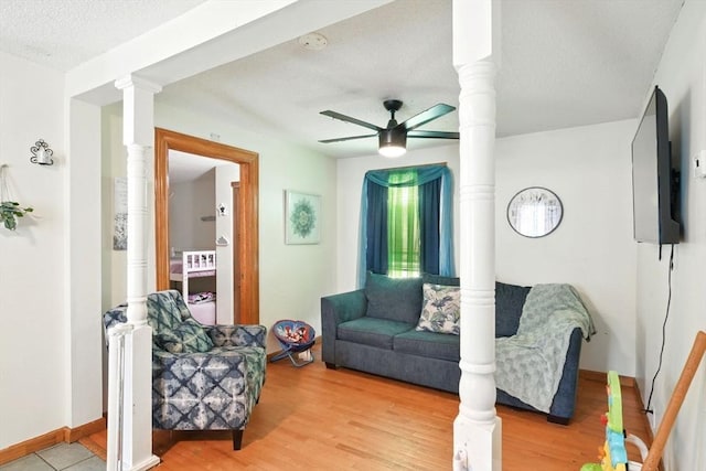 47 N Summer St, Holyoke, MA 01040 - living room with a ceiling fan, wood finished floors, a textured ceiling, and baseboards