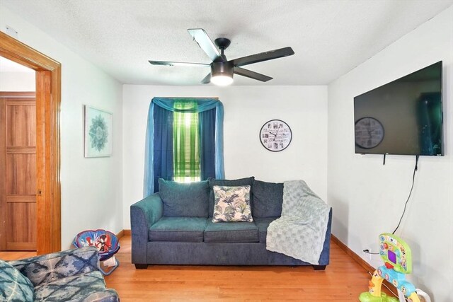 47 N Summer St, Holyoke, MA 01040 - living room featuring a ceiling fan, wood finished floors, and baseboards