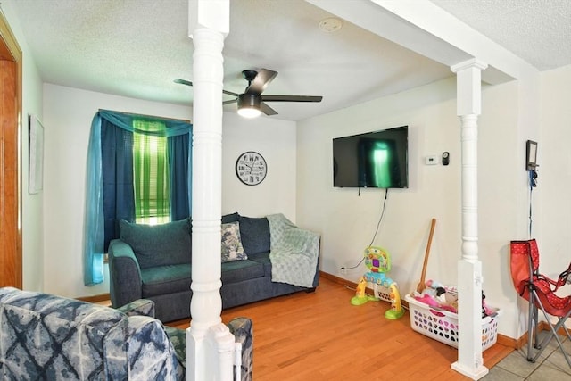 47 N Summer St, Holyoke, MA 01040 - living area featuring a ceiling fan, baseboards, wood finished floors, and a textured ceiling