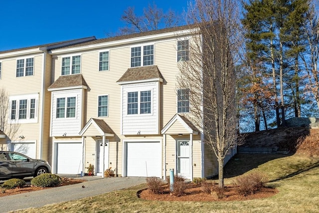 townhome / multi-family property featuring a garage