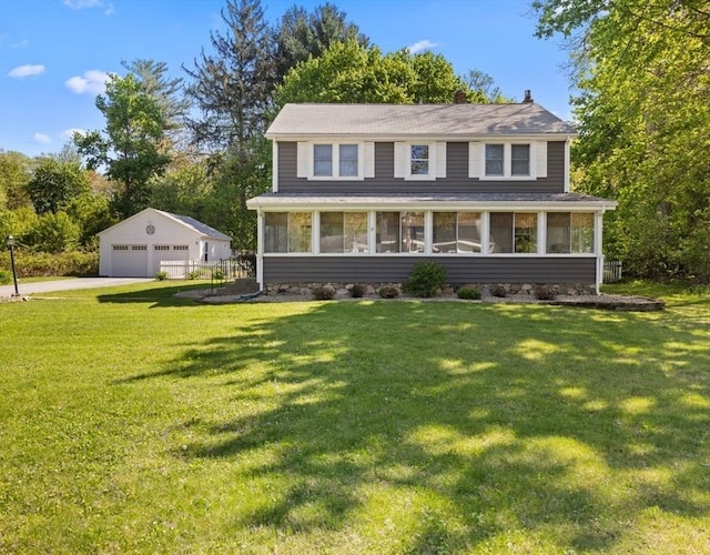 71 Dudley St, Marlborough, MA 01752 - view of front of home with a sunroom, a detached garage, an outdoor structure, and a front lawn