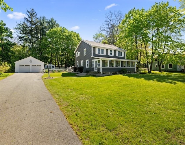 71 Dudley St, Marlborough, MA 01752 - view of front facade featuring a detached garage, an outbuilding, and a front yard