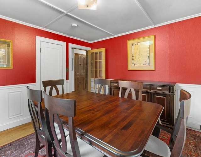 71 Dudley St, Marlborough, MA 01752 - dining area with a decorative wall, wood finished floors, wainscoting, and a textured wall