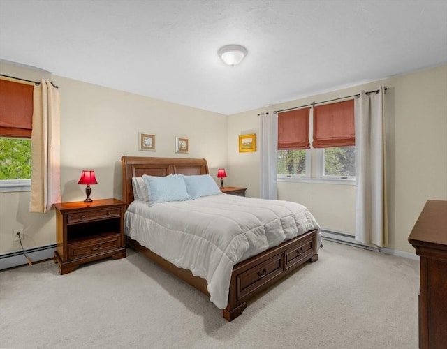 71 Dudley St, Marlborough, MA 01752 - bedroom with light carpet, multiple windows, baseboard heating, and a baseboard heating unit