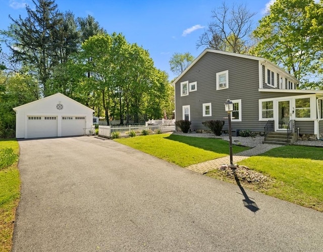 71 Dudley St, Marlborough, MA 01752 - view of side of home with entry steps, a garage, and an outdoor structure